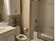 Cozy bathroom features a shower-tub combo and a white vanity for ample storage at 2084 Cobblestone Ne Cir, Brookhaven, GA 30319