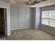 Spacious bedroom featuring decorative wall paneling, plush carpet and large window at 2084 Cobblestone Ne Cir, Brookhaven, GA 30319