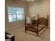Bedroom featuring a large window and carpeted floors at 2084 Cobblestone Ne Cir, Brookhaven, GA 30319