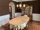 Elegant dining room with hardwood floors, a large table, and decorative chandelier at 2084 Cobblestone Ne Cir, Brookhaven, GA 30319