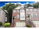 Beautiful brick townhome with a two-car garage, traditional architecture, and welcoming entrance at 2084 Cobblestone Ne Cir, Brookhaven, GA 30319