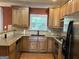 Updated kitchen with wood cabinets, granite countertops, and stainless steel appliances at 2084 Cobblestone Ne Cir, Brookhaven, GA 30319