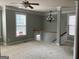 Spacious loft area with natural light, crown molding, and neutral carpet at 2084 Cobblestone Ne Cir, Brookhaven, GA 30319