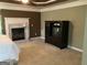 Spacious main bedroom with a fireplace, trey ceiling and bright windows at 2084 Cobblestone Ne Cir, Brookhaven, GA 30319