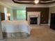 Large main bedroom with a fireplace, trey ceiling and bright windows at 2084 Cobblestone Ne Cir, Brookhaven, GA 30319