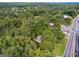 Aerial view of the property surrounded by lush trees at 4443 Flat Shoals, Decatur, GA 30034