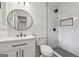 Modern bathroom with a new toilet and a tiled walk-in shower at 4443 Flat Shoals, Decatur, GA 30034