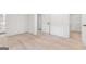 Spacious bedroom featuring clean, light-toned hardwood floors, and large closets at 4443 Flat Shoals, Decatur, GA 30034