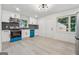 Modern kitchen boasts stainless appliances, sleek cabinets, and hardwood floors at 4443 Flat Shoals, Decatur, GA 30034