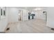 Bright living room features hardwood floors, and a view to the kitchen and front entry at 4443 Flat Shoals, Decatur, GA 30034