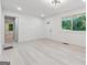 Bright living room features hardwood floors, and a view to the front entry at 4443 Flat Shoals, Decatur, GA 30034