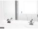 Modern bathroom featuring dual sinks, walk in tub, and sleek fixtures at 6127 Landers Loop, Fairburn, GA 30213