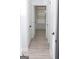 Bright hallway with white doors, tiled floors, and natural light at 6127 Landers Loop, Fairburn, GA 30213