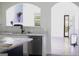 Modern kitchen with marble countertops, stainless steel appliances, and eat-in bar at 6127 Landers Loop, Fairburn, GA 30213
