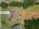 Aerial view of the home with a backyard deck, lush greenery and well-maintained landscaping at 10038 Hemlock Way, Jonesboro, GA 30238