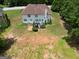 Aerial view of the home with a spacious backyard, featuring a deck and landscaping at 10038 Hemlock Way, Jonesboro, GA 30238