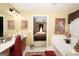 This bathroom features a tub, vanity, and a doorway into a bedroom with a large four-poster bed at 10038 Hemlock Way, Jonesboro, GA 30238