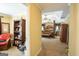 Open doorway to a Primary bedroom featuring a four-poster bed and connected office at 10038 Hemlock Way, Jonesboro, GA 30238