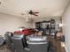 Finished bonus room with seating, dark vinyl floors and ceiling fans at 10038 Hemlock Way, Jonesboro, GA 30238