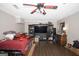 Spacious bonus room features entertainment center, ceiling fan, and vinyl plank flooring at 10038 Hemlock Way, Jonesboro, GA 30238