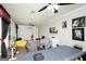 Spacious bonus room with seating, ceiling fans and bright paint at 10038 Hemlock Way, Jonesboro, GA 30238