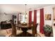 Charming dining area featuring a wooden table with seating for four, near a door to the outside at 10038 Hemlock Way, Jonesboro, GA 30238