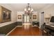 Elegant dining room featuring hardwood floors and chandelier. Comfortable and inviting space at 10038 Hemlock Way, Jonesboro, GA 30238