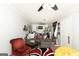 Spacious living room with modern sofa, fan, bright paint, and an open layout at 10038 Hemlock Way, Jonesboro, GA 30238