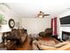 Cozy living room features hardwood floors, fireplace and comfortable seating at 10038 Hemlock Way, Jonesboro, GA 30238