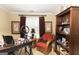 Office featuring a large desk, comfortable chair, and ample storage space with natural light at 10038 Hemlock Way, Jonesboro, GA 30238