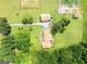 Aerial view of a home on sprawling land with lush green grass and mature trees at 1502 Campground, Mcdonough, GA 30252