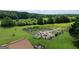 Expansive garden near brick home; surrounded by lush greenery and mature trees at 1502 Campground, Mcdonough, GA 30252