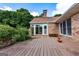 Spacious wooden deck featuring ample seating with an enclosed fence, overlooking a lush, green backyard at 1502 Campground, Mcdonough, GA 30252