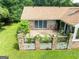 Brick backyard patio with lush plants and brick pillars creating a charming outdoor space at 1502 Campground, Mcdonough, GA 30252