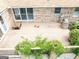 A backyard patio featuring lush greenery around the brick pillars and a wooden deck space at 1502 Campground, Mcdonough, GA 30252