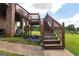 Rear exterior view with an elevated deck, offering views of the backyard and surrounding greenery at 1502 Campground, Mcdonough, GA 30252