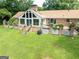 Spacious backyard featuring a brick patio with an entertainment space, and an expansive lawn at 1502 Campground, Mcdonough, GA 30252