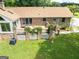A backyard deck surrounded by lush plants and brick pillars perfect for outdoor entertaining at 1502 Campground, Mcdonough, GA 30252