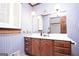 This bathroom features a wood vanity with drop-in sink and unique striped wallpaper at 1502 Campground, Mcdonough, GA 30252