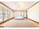 Large bedroom has neutral paint, trim, carpet, and great natural light at 1502 Campground, Mcdonough, GA 30252