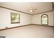 This bright bedroom boasts neutral paint and carpet, highlighted by generous natural light at 1502 Campground, Mcdonough, GA 30252