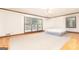 Spacious bedroom featuring neutral carpet, trim, and large windows for natural light at 1502 Campground, Mcdonough, GA 30252