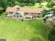 Charming brick home features a sunroom, patio area, and spacious backyard at 1502 Campground, Mcdonough, GA 30252