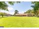 Sprawling front yard of a brick home with a detached garage in a wooded setting at 1502 Campground, Mcdonough, GA 30252