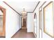 Hallway featuring decorative windows and a unique ceiling light fixture at 1502 Campground, Mcdonough, GA 30252