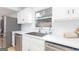 Close-up of the modern kitchen, showcasing stainless steel appliances and countertops with a sink at 1502 Campground, Mcdonough, GA 30252