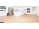 Spacious, updated kitchen featuring stainless steel appliances, a center island, and new wood flooring at 1502 Campground, Mcdonough, GA 30252