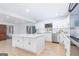 Bright, updated kitchen with stainless steel appliances, quartz countertops, and a large center island at 1502 Campground, Mcdonough, GA 30252