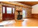 Welcoming room with brickwork, a wood stove, stained glass, hardwood floors, and a decorative entrance at 1502 Campground, Mcdonough, GA 30252