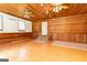Spacious room with wood-paneled walls and ceilings, tiled entrance, and mini-split climate control at 1502 Campground, Mcdonough, GA 30252
